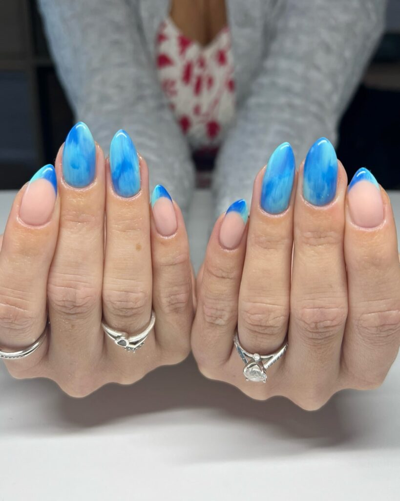Sky Blue French Almond Nails with Nude Base and Watercolor Effect