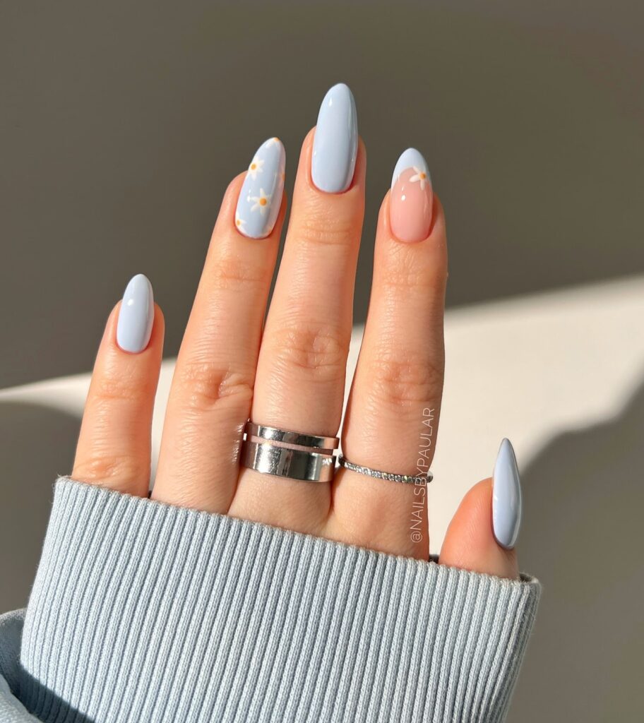 Soft Almond Baby Blue Nails with Nude Base and Delicate Daisy Floral Nail Ideas for Spring
