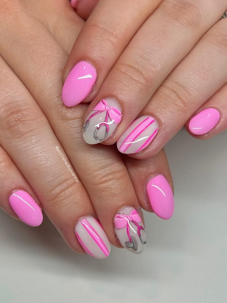 Soft Almond Nails in Light Pink and Nude with Medical Graduation Nail Art and Ribbon Details