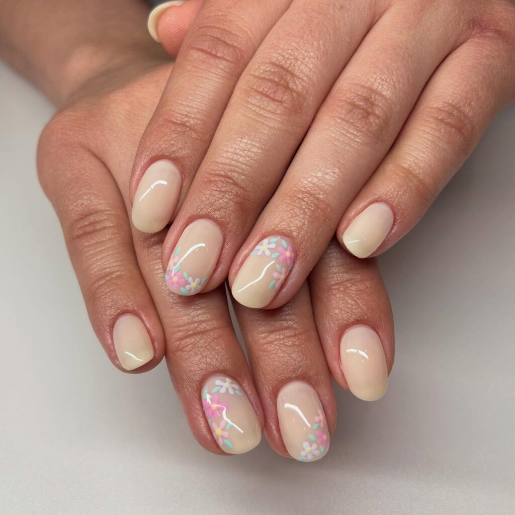 Soft Nude Oval Nails with Delicate Pastel Blossoms for Feminine Floral Nail Ideas