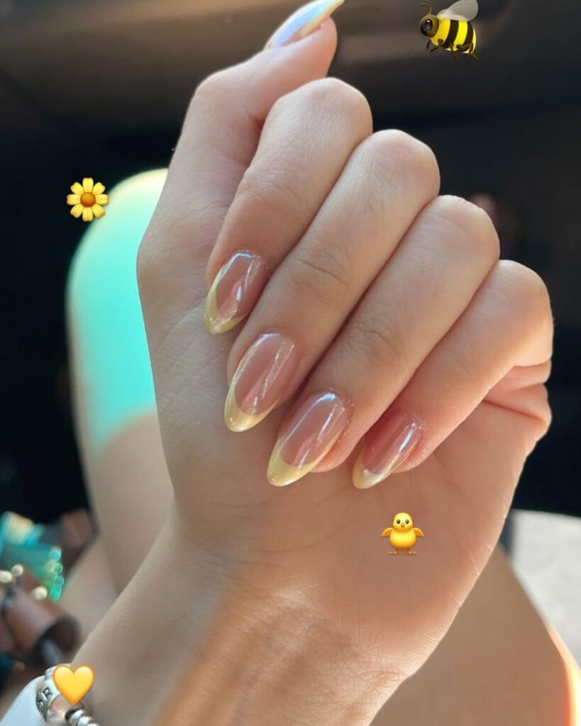 Soft Yellow Micro-French Almond Nails with Sheer Nude Base