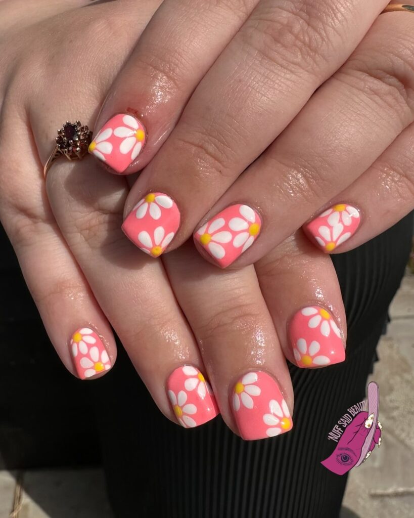 Square Coral Nails with Hand-Painted White Daisies for a Spring Garden Vibe