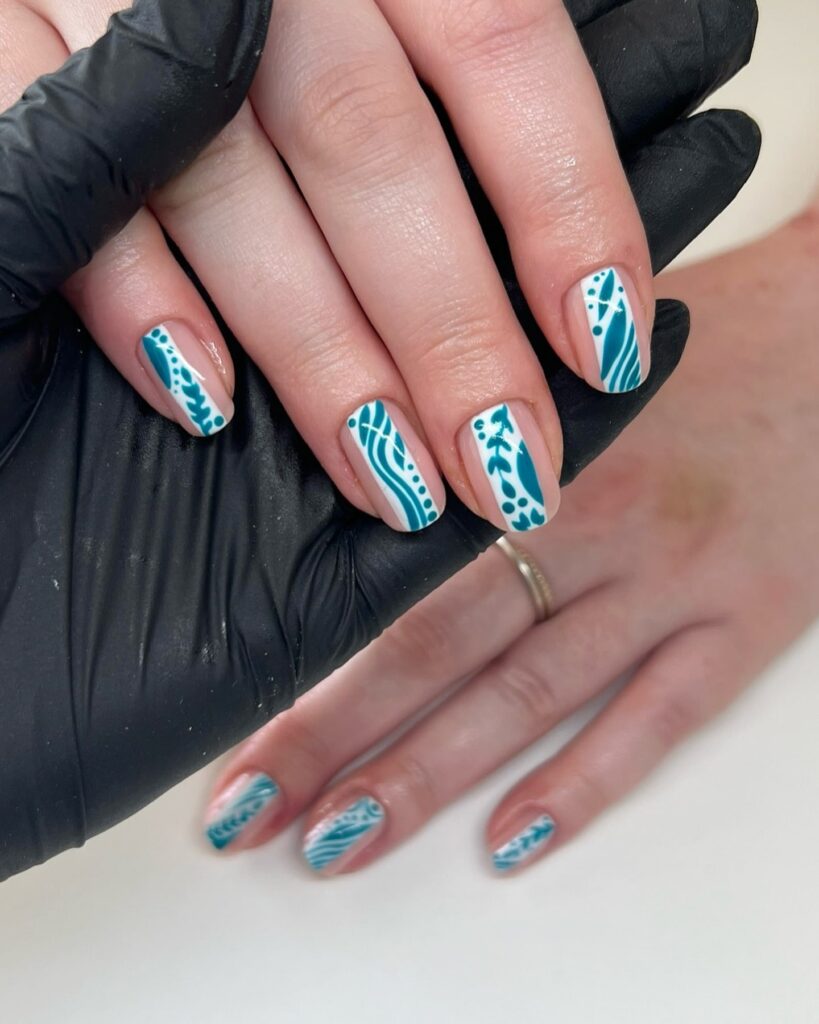 Square white and teal nails with hand painted botanical art for a modern abstract nail design idea