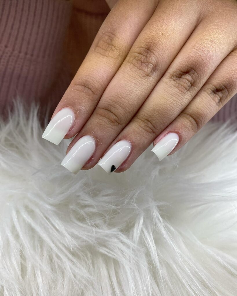 Square White Nails with a Minimal Black Heart Accent for a Playful Twist