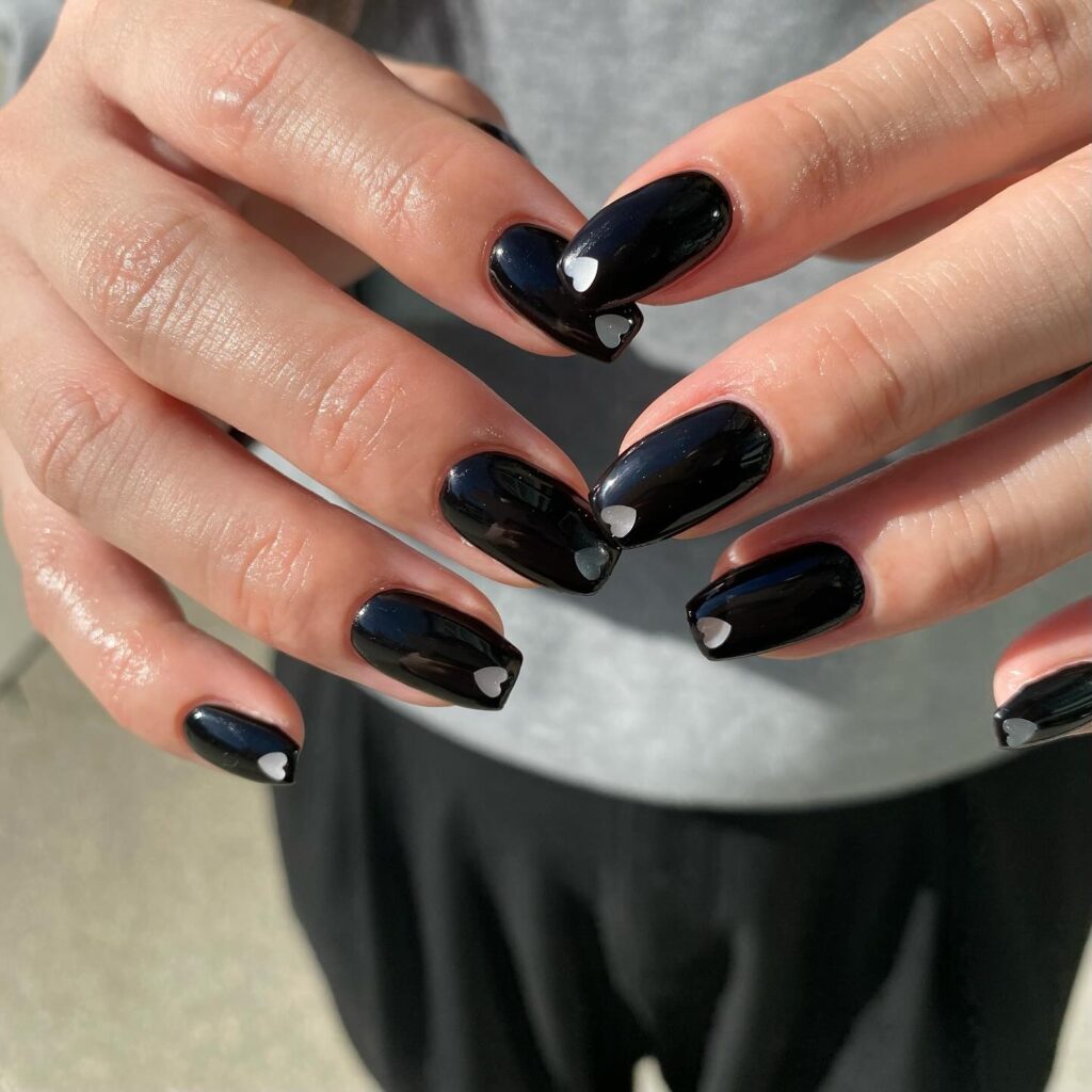 Squoval Black Nails with Minimal White Heart Cutouts