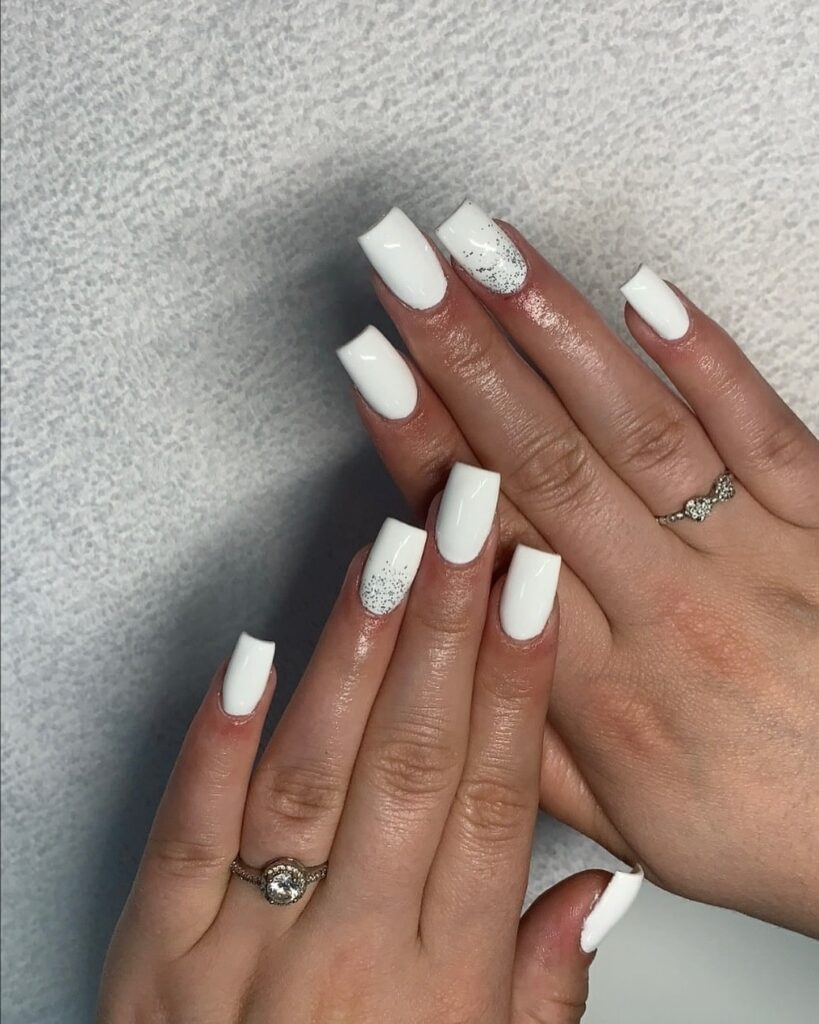 Squoval White Nails with Silver Glitter Cuticle Fade for a Bridal Glow