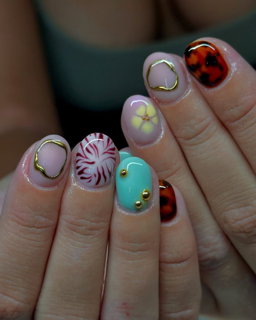 Tiny Twinkling Gem Nails on Nude Short Rounds for a Magical Everyday Look