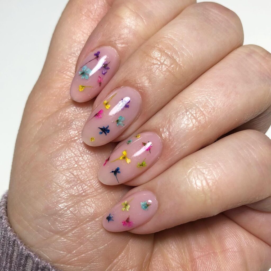 Whimsical Butterfly Garden Almond Nails in Spring Pastels – Birthday Nail Ideas to Brighten Your Look