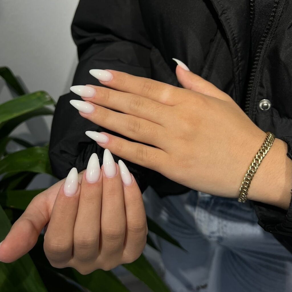 White Ombré Stiletto Nails for a Bold Yet Elegant Gradient Look