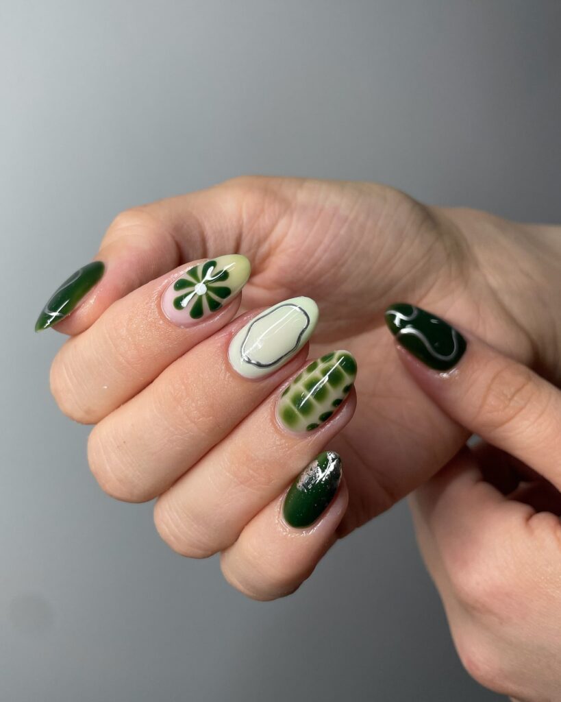 Almond Green Swirl Nails with Daisies and Marbled Tips for a Nature-Inspired Summer