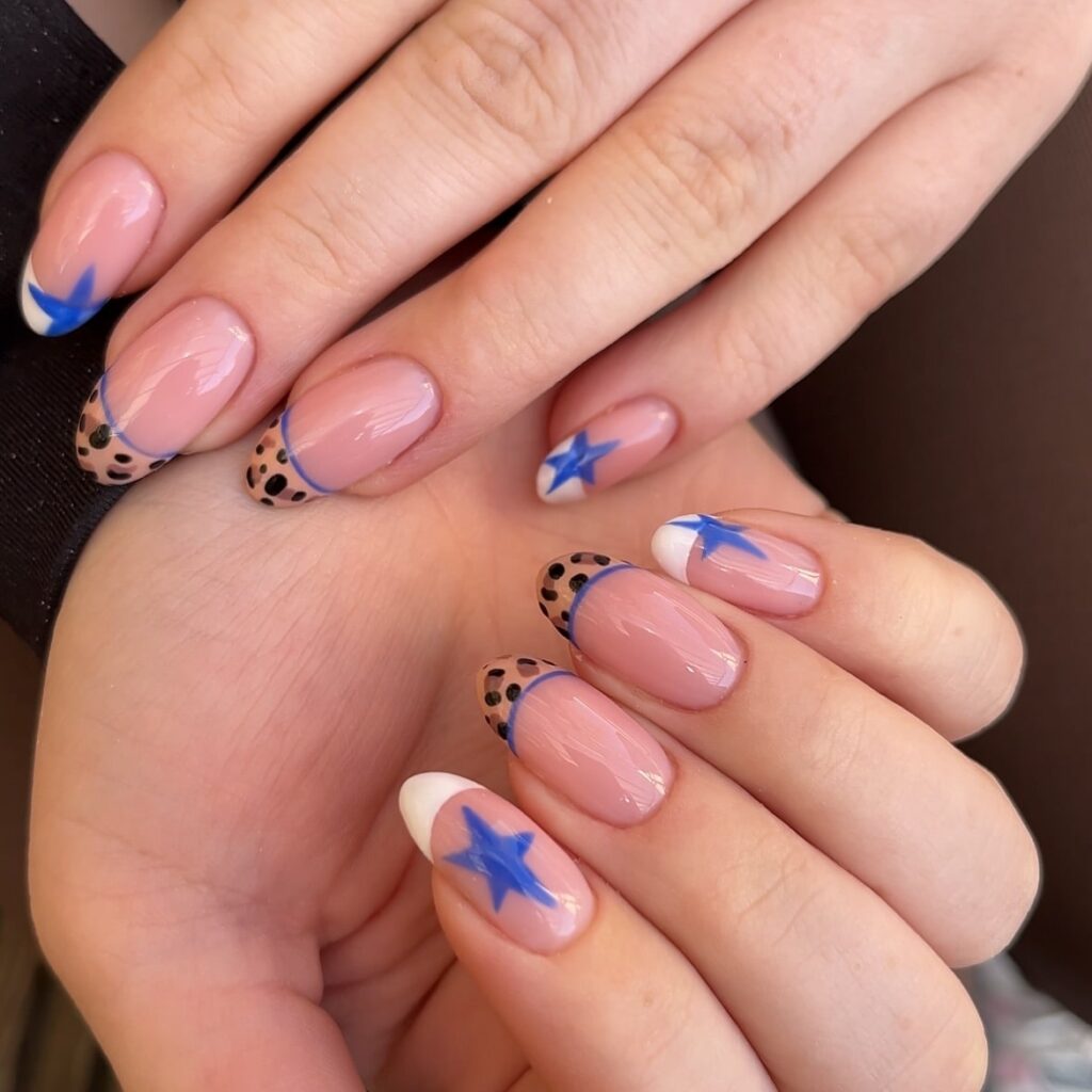 Almond Nude Nails with Leopard and Star French Tips for a Trendy Summer Twist