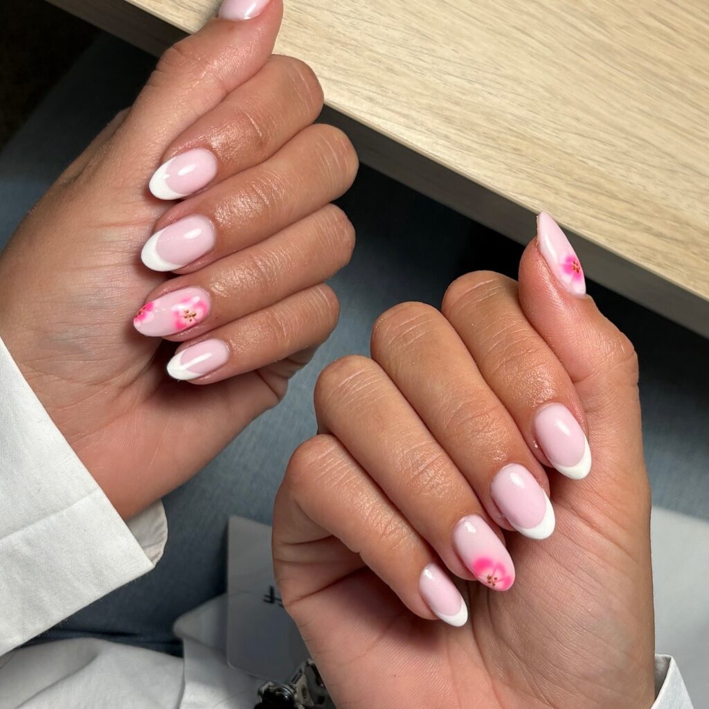 Baby Pink French Tips with Blossom Accents on Almond Nails for a Romantic Spring Look