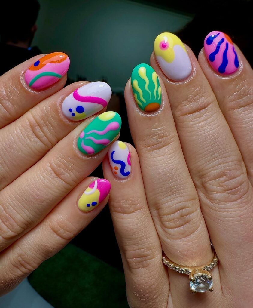Bold Abstract Neon Nail Ideas with Glossy Round Tips for a Playful Summer Look