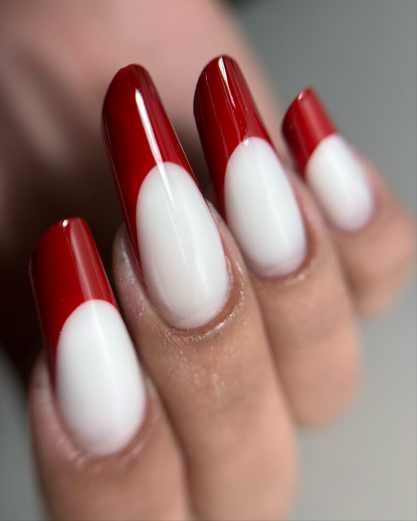 Bold White Coffin Nails with Red Reverse French Tips for a Statement Look