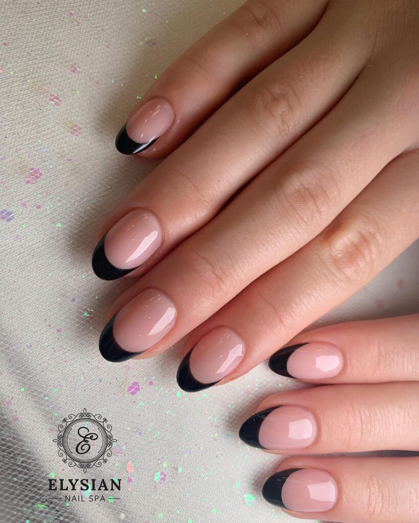Chic Black French Tips on Almond Nude Nails for a Sophisticated Birthday Look