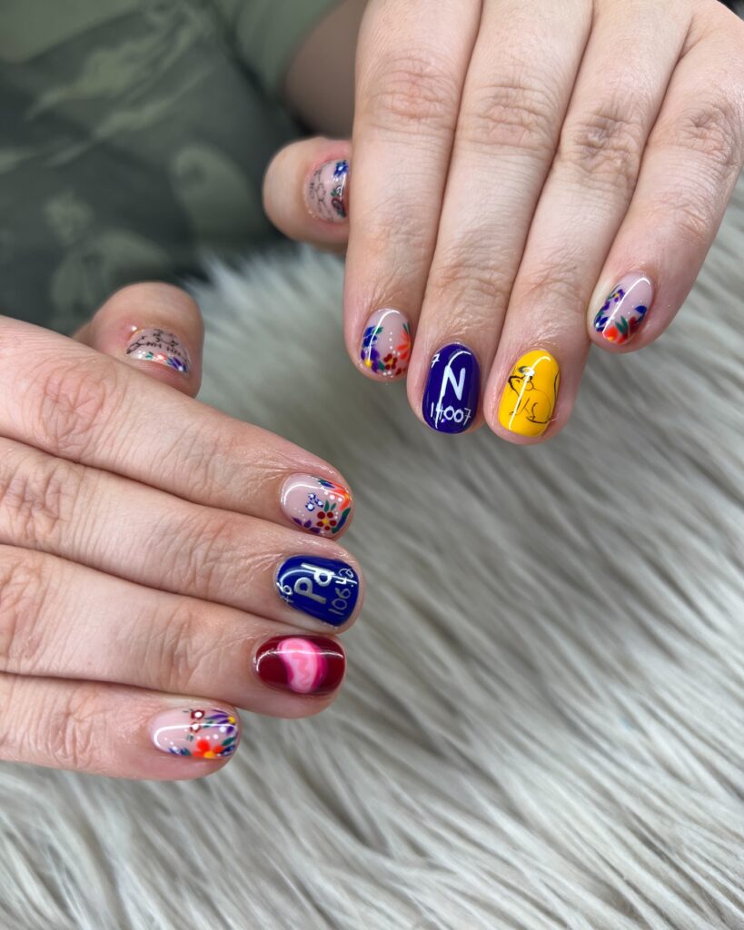 Colorful Short Graduation Nails with Abstract Art, Periodic Lettering, and Florals