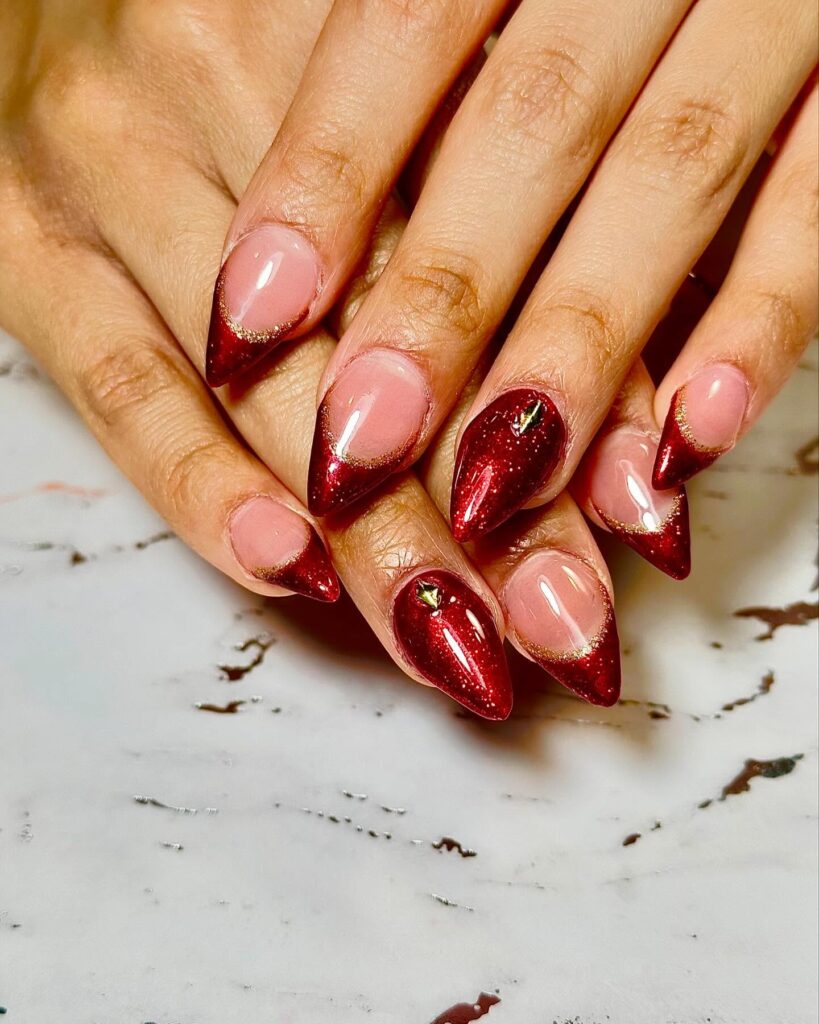 Deep Red Glitter French Tip Almond Nails for a Glam Graduation Celebration