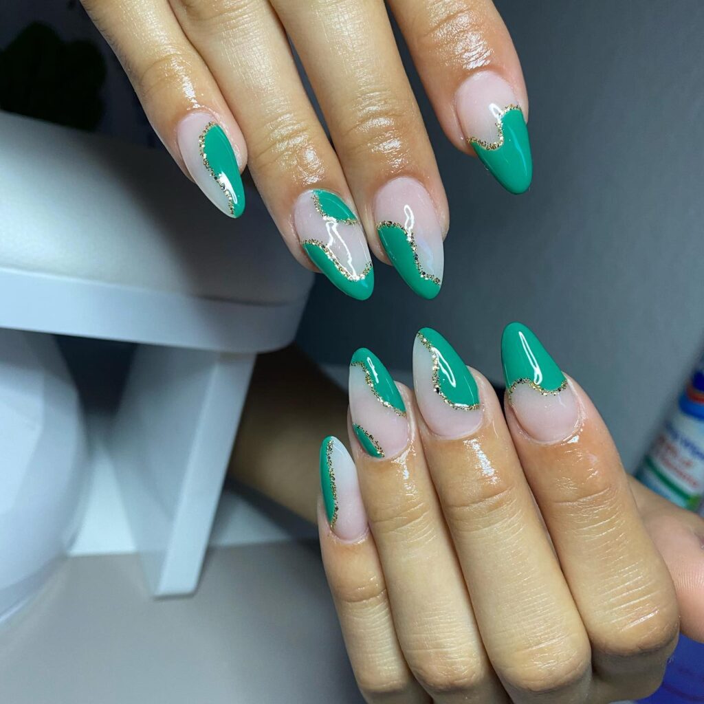 Emerald Green Almond Nails with Gold Swirls for a Modern Graduation Glam Look