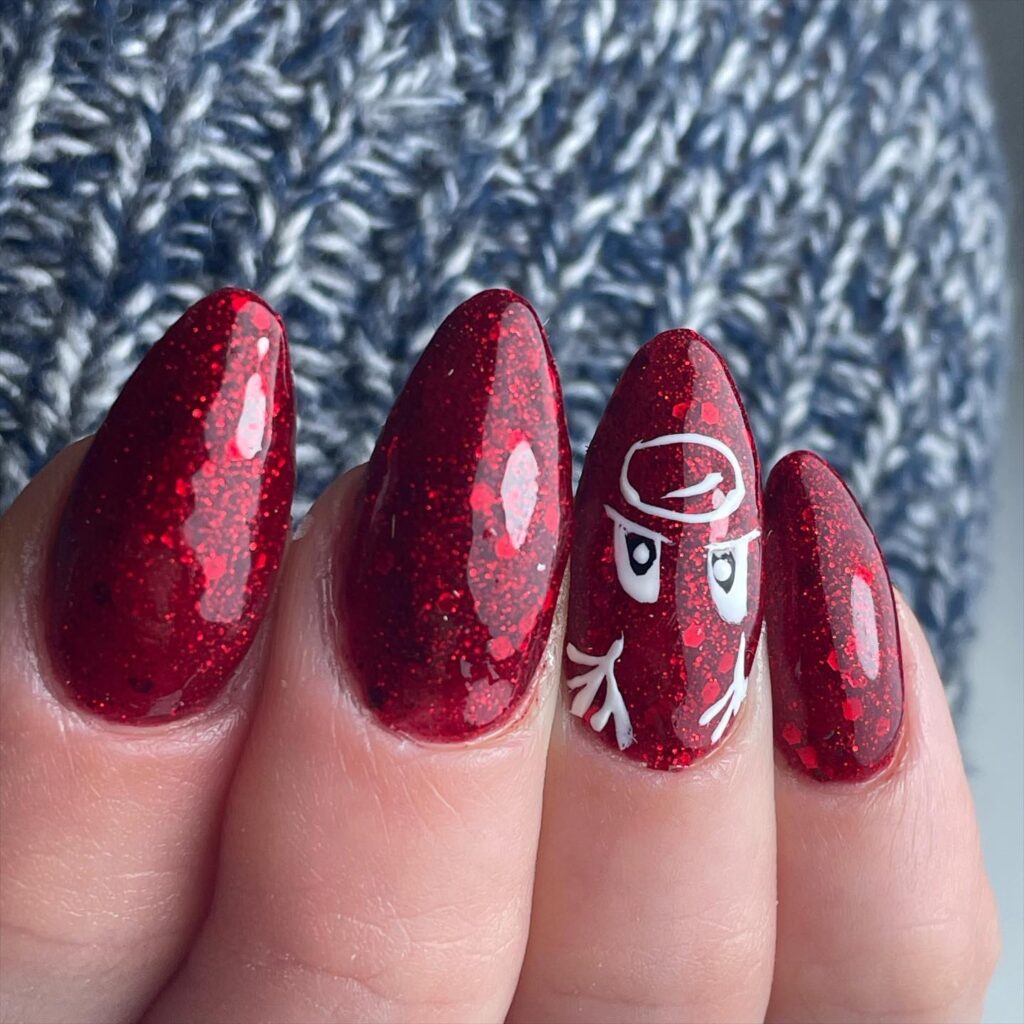 Festive Glitter Red Almond Nails with Playful Ninja Art