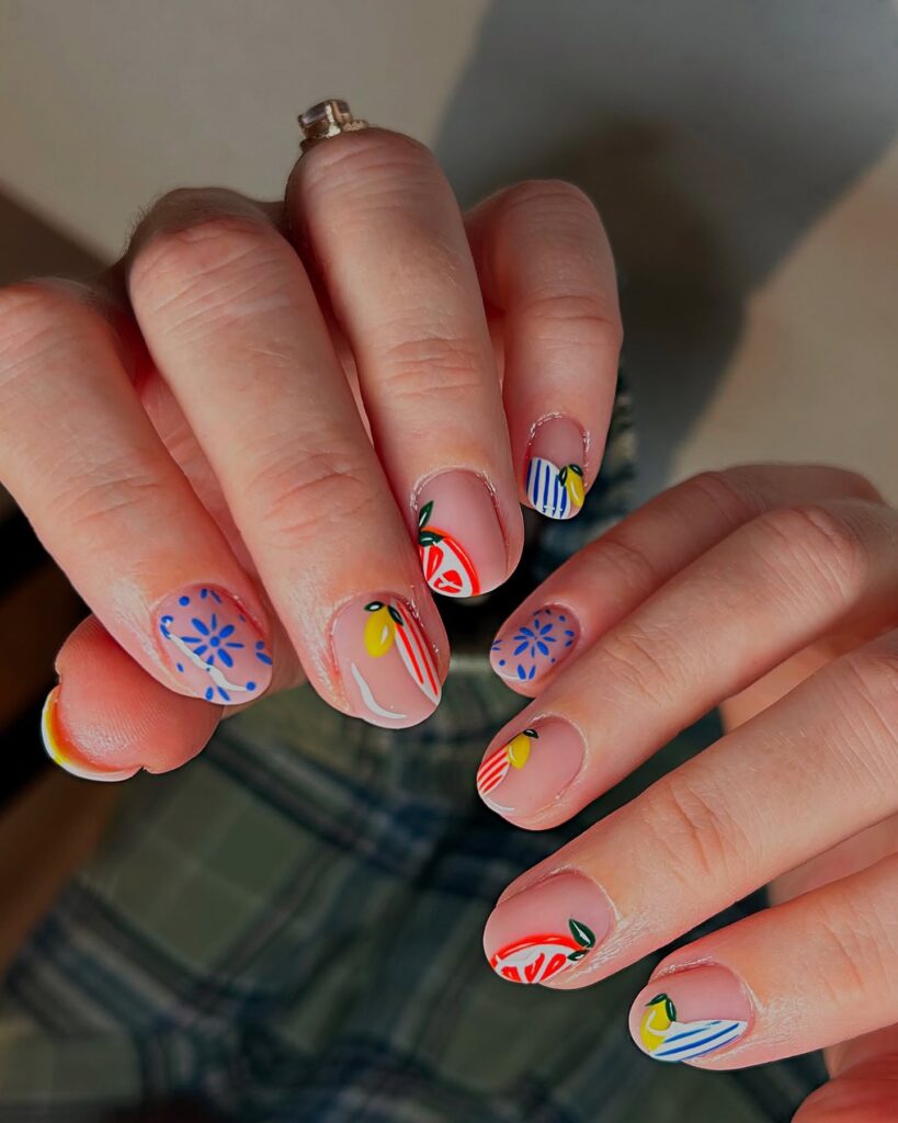 Fruit Slice Nail Art on Short Round Nails with Floral Pops for a Fresh Summer Touch