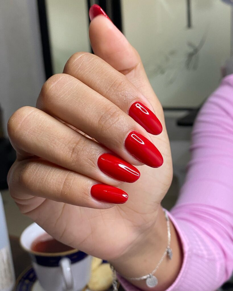 Glossy Almond Red Nails That Radiate Timeless Elegance
