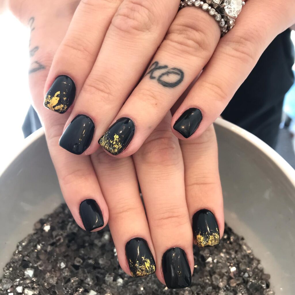 Glossy Black and Gold Foil Nails in a Chic Square Shape