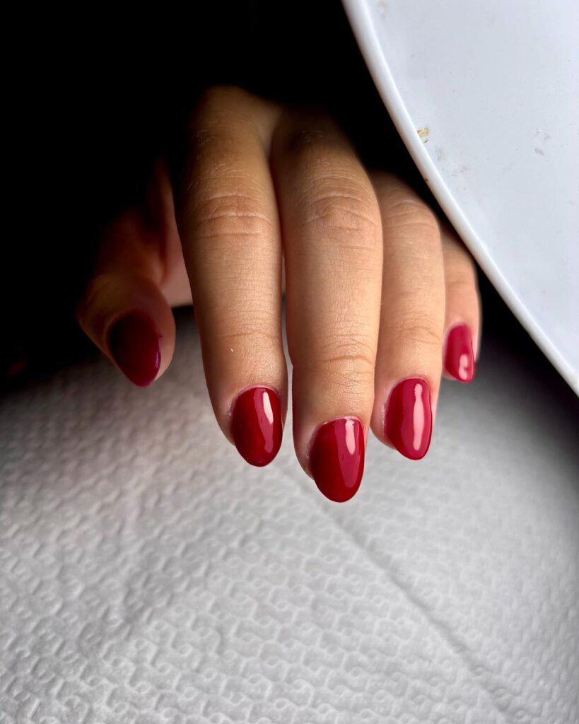 Glossy Deep Red Almond Nails for a Bold and Sophisticated Everyday Look