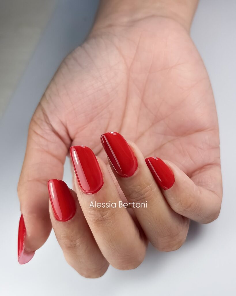 Glossy Red Almond Nails for a Timeless Glam Look