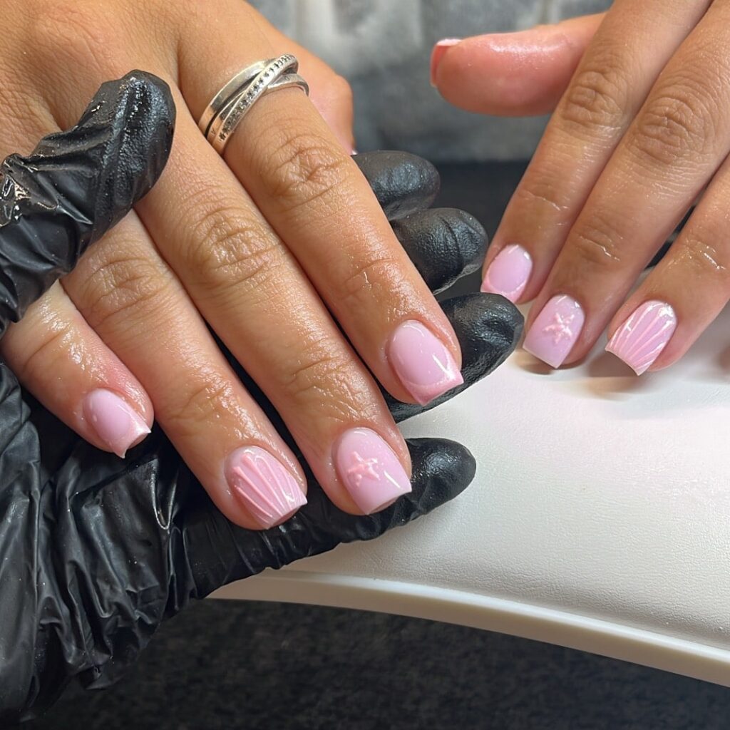 Glossy Square Pink Nails with Subtle Stars and 3D Accents for a Cute Summer Statement
