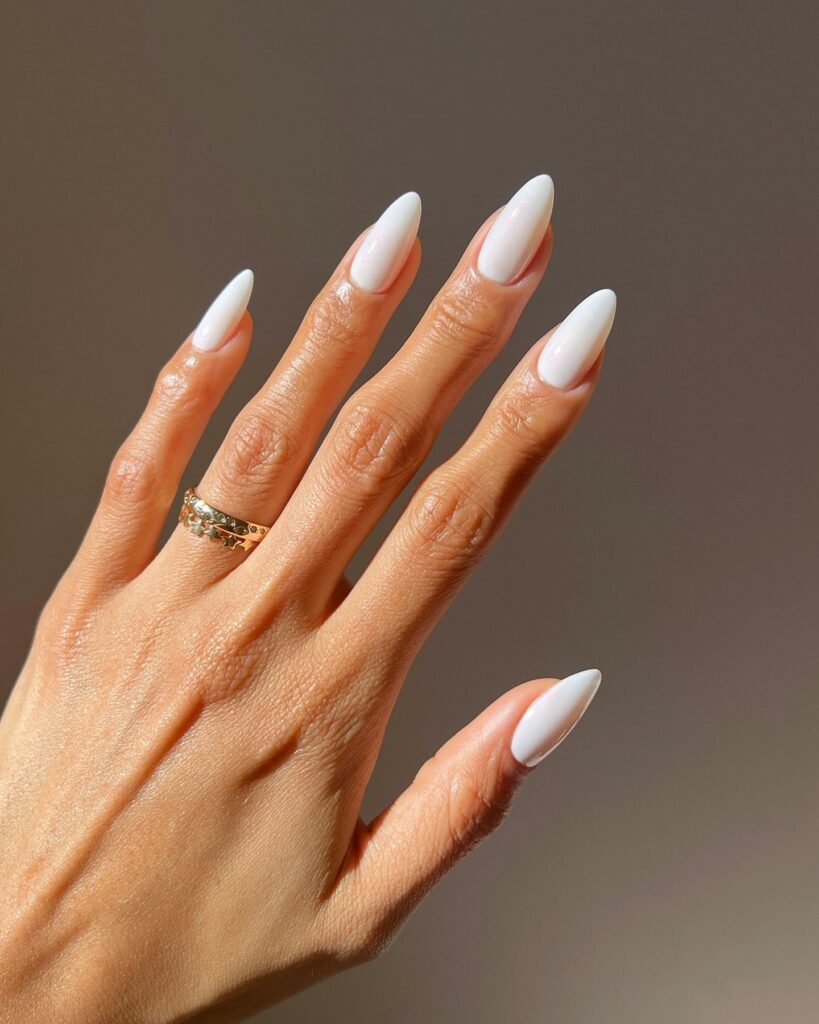 Glossy White Almond Nails for a Bold Yet Minimal Summer Office Manicure
