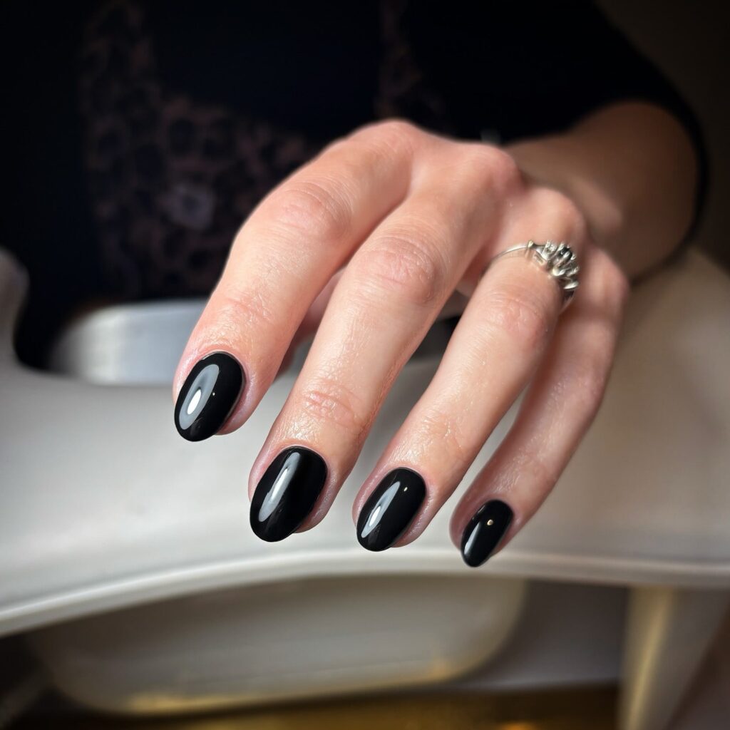 Jet black oval nails high gloss manicure bold and elegant nail ideas