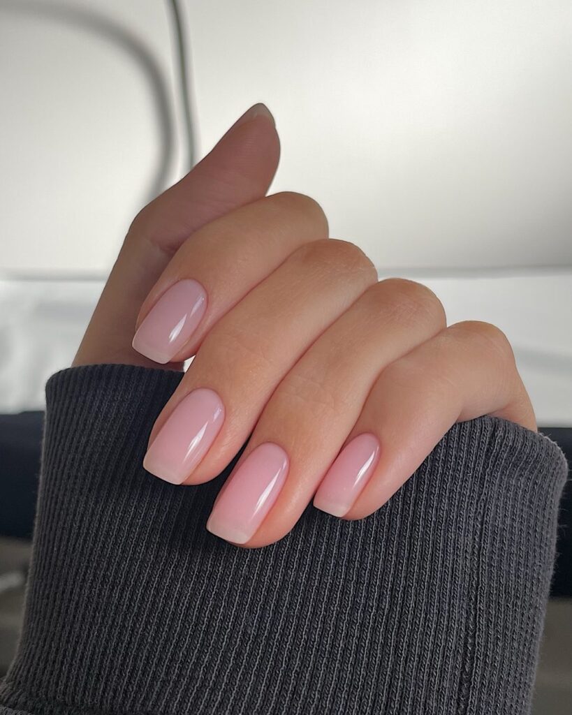 Keep it minimal with square nails and sheer pink polish for a natural everyday office look