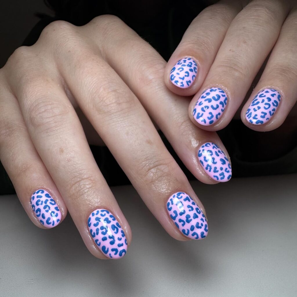 Light pink oval nails with cobalt blue leopard print trendy simple nail ideas