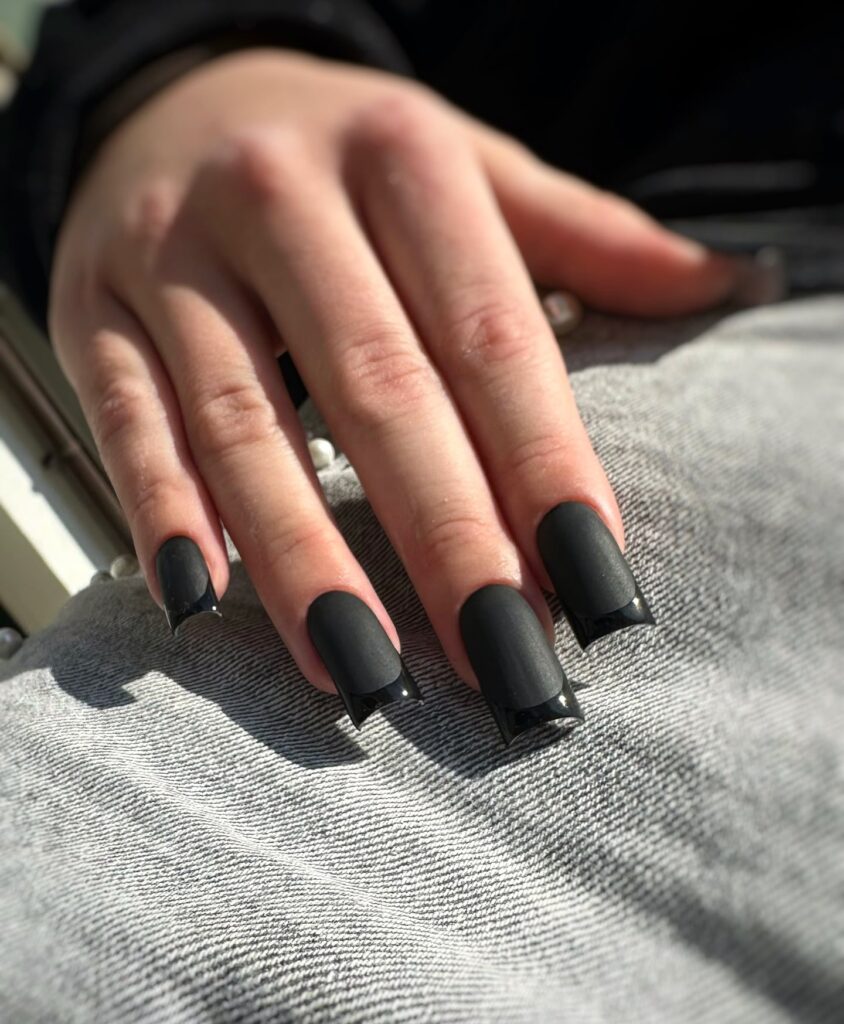 Matte and glossy black square nails with contrasting textures for a modern look