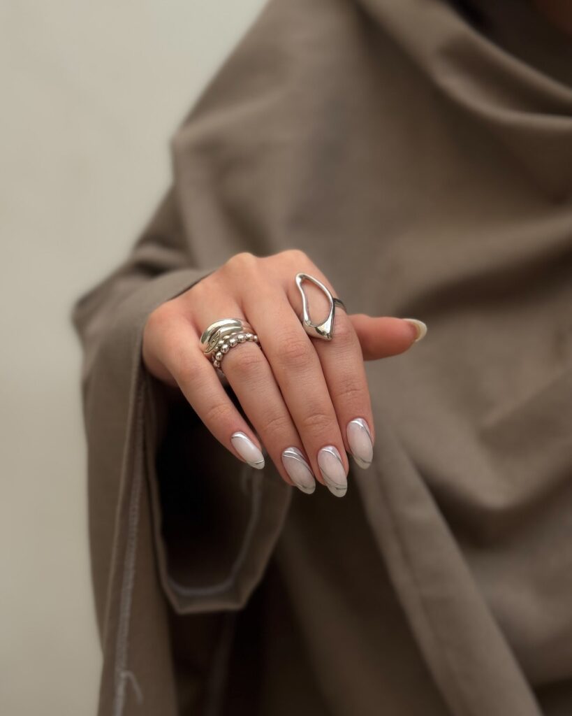 Milky Almond Nails with Marble and Metallic Accents for Artistic Office Glam