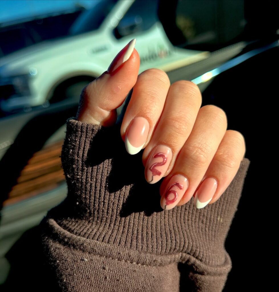 Minimalist French Tip Almond Nails with Red Birthday Numbers – Personalized Nail Ideas