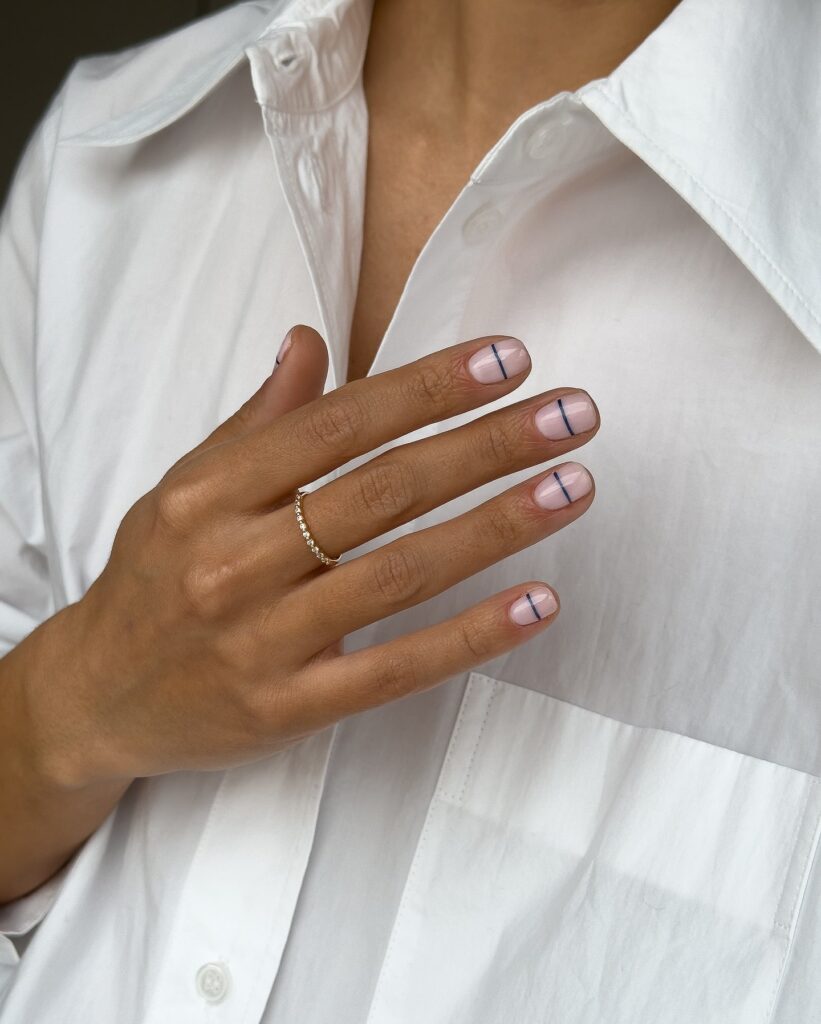 Minimalist Grid Nail Art on Nude Rounded Nails for a Creative Office Vibe