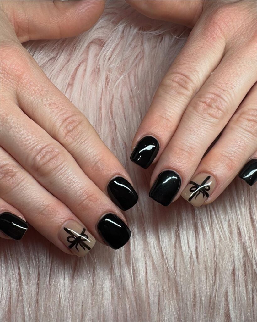 Minimalist Square Black Nails with Nude Base and Bow Accent Details