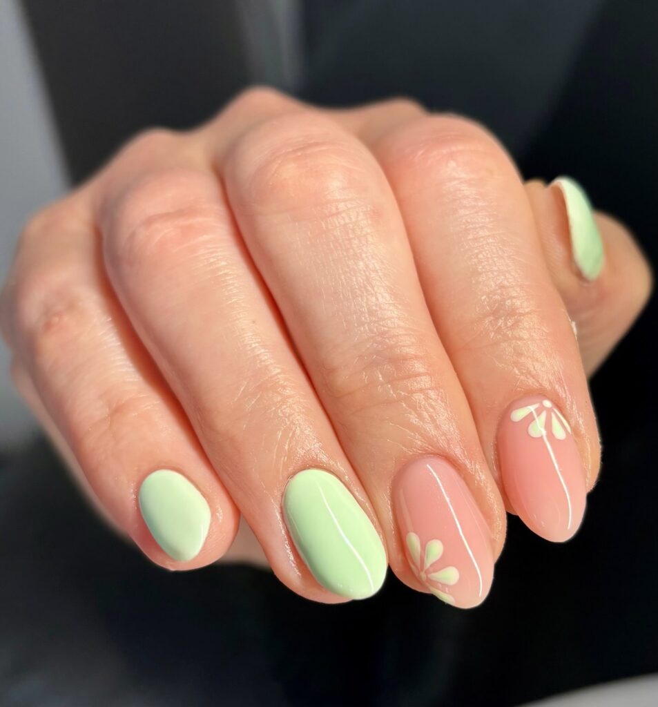 Mint and peach alternating nails with yellow floral art simple spring nail ideas