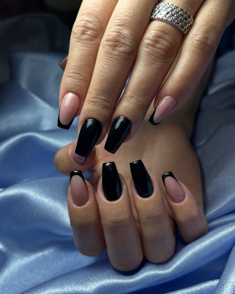 Modern black French tip nails on nude base for a sophisticated square manicure