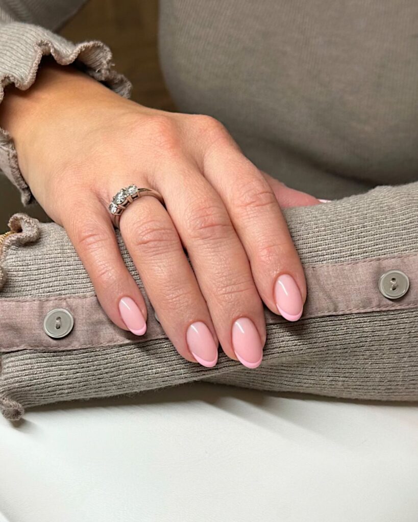 Modern Pink French Tips on Almond Nails for Subtle Office Glam