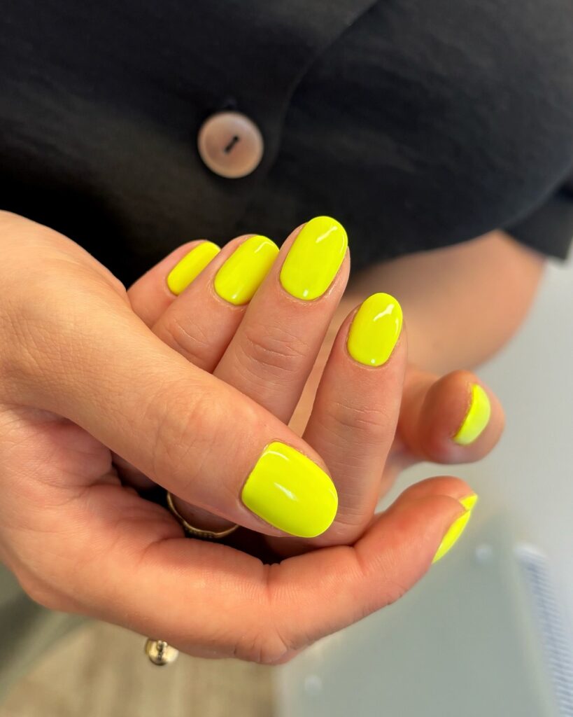 Neon yellow oval nails for bold and vibrant summer nail ideas