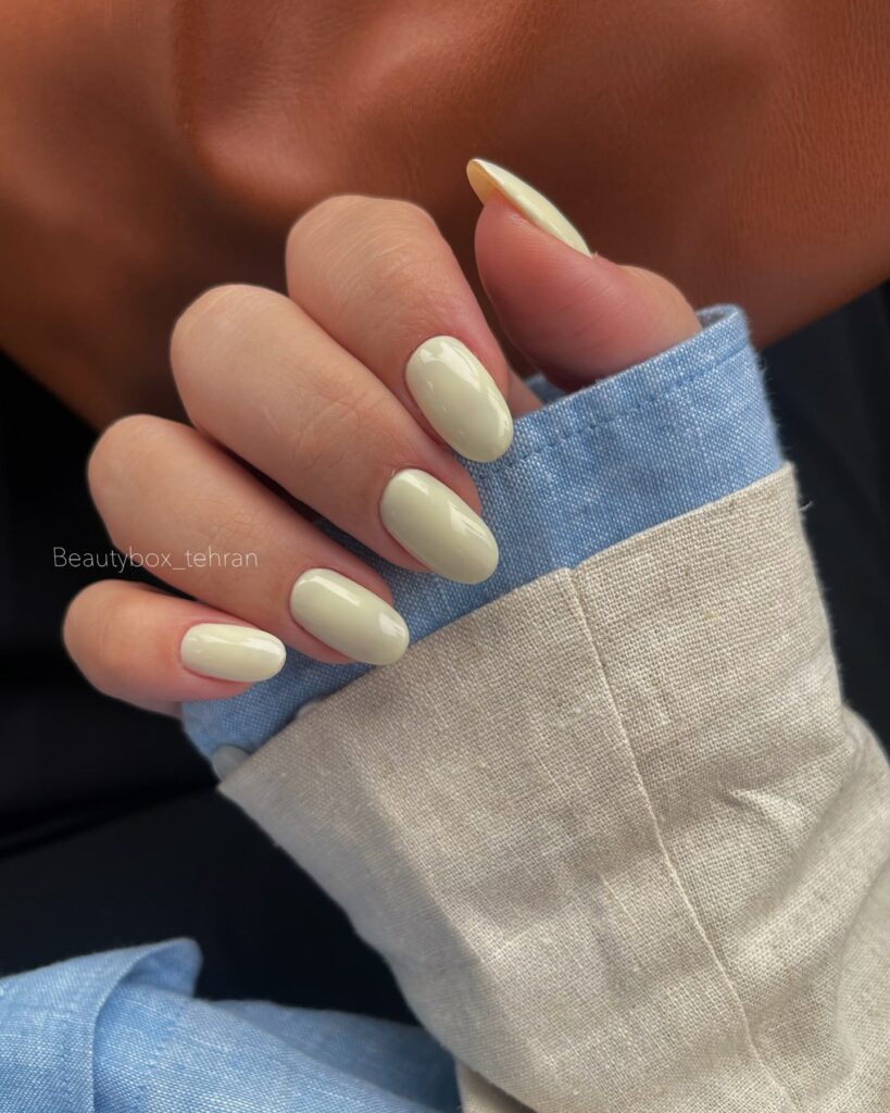 Pale yellow oval nails with glossy finish for fresh spring nail looks