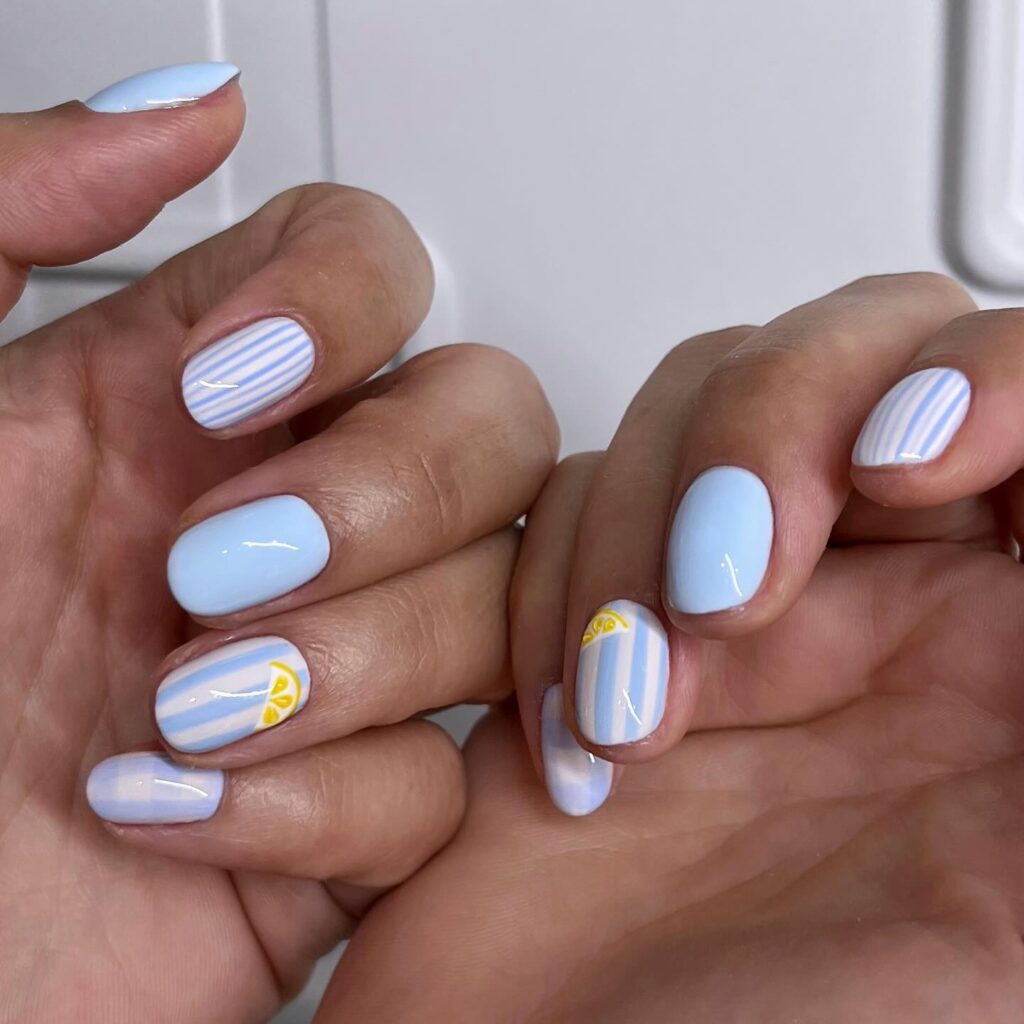 Pastel Blue Lemon Art Nails with Vertical Stripes for a Fresh Vacation Vibe