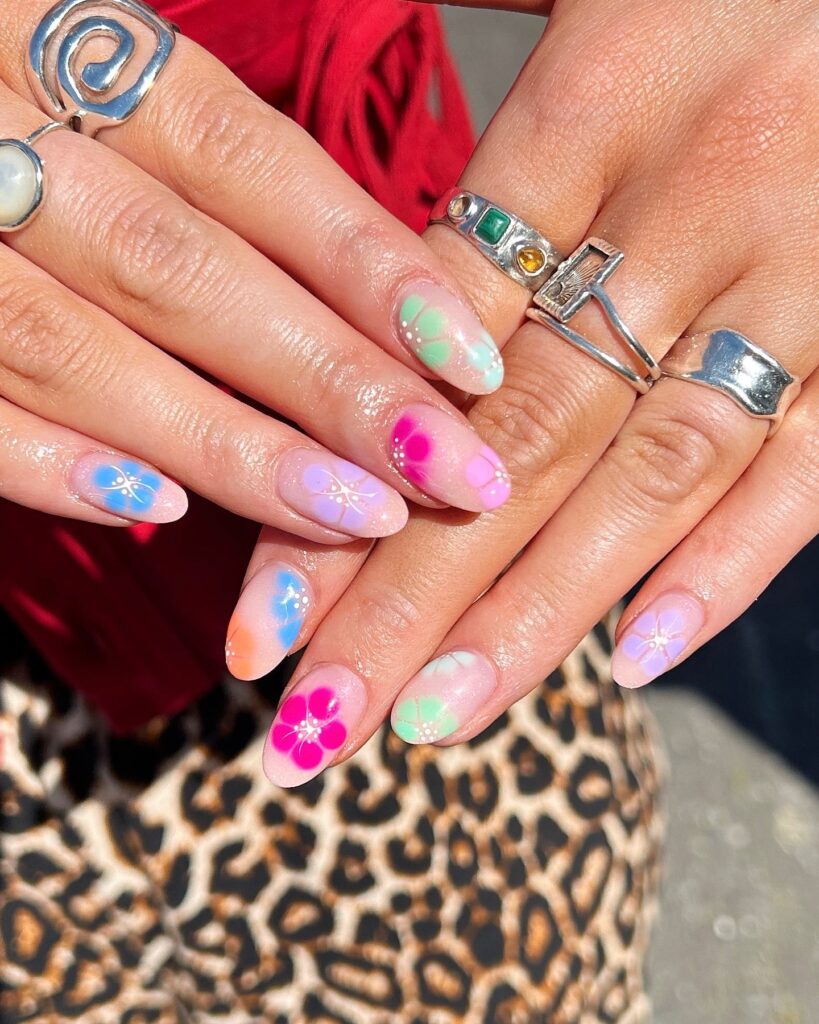 Pastel Ombré Almond Nails with Bold Flowers for a Playful Summer Festival Style