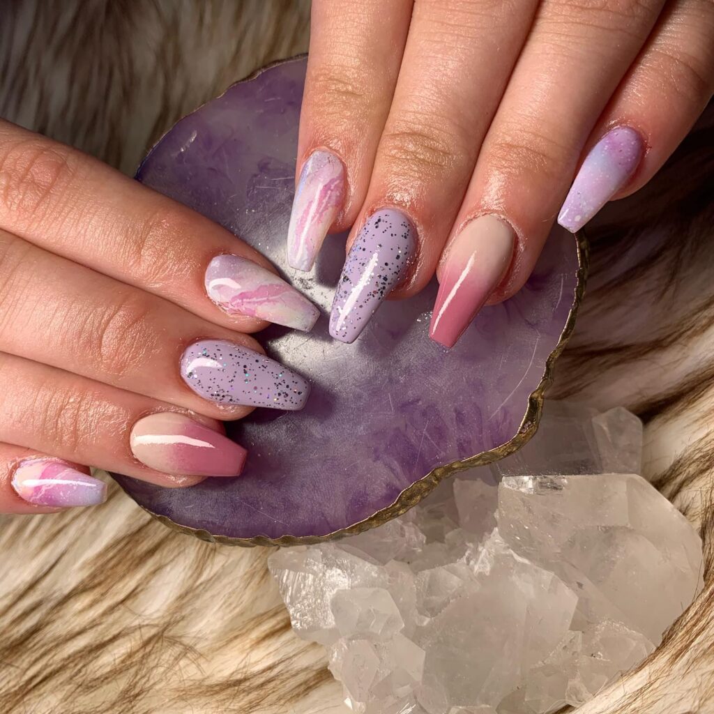 Pastel pink and purple marble almond nails for dreamy spring graduation looks