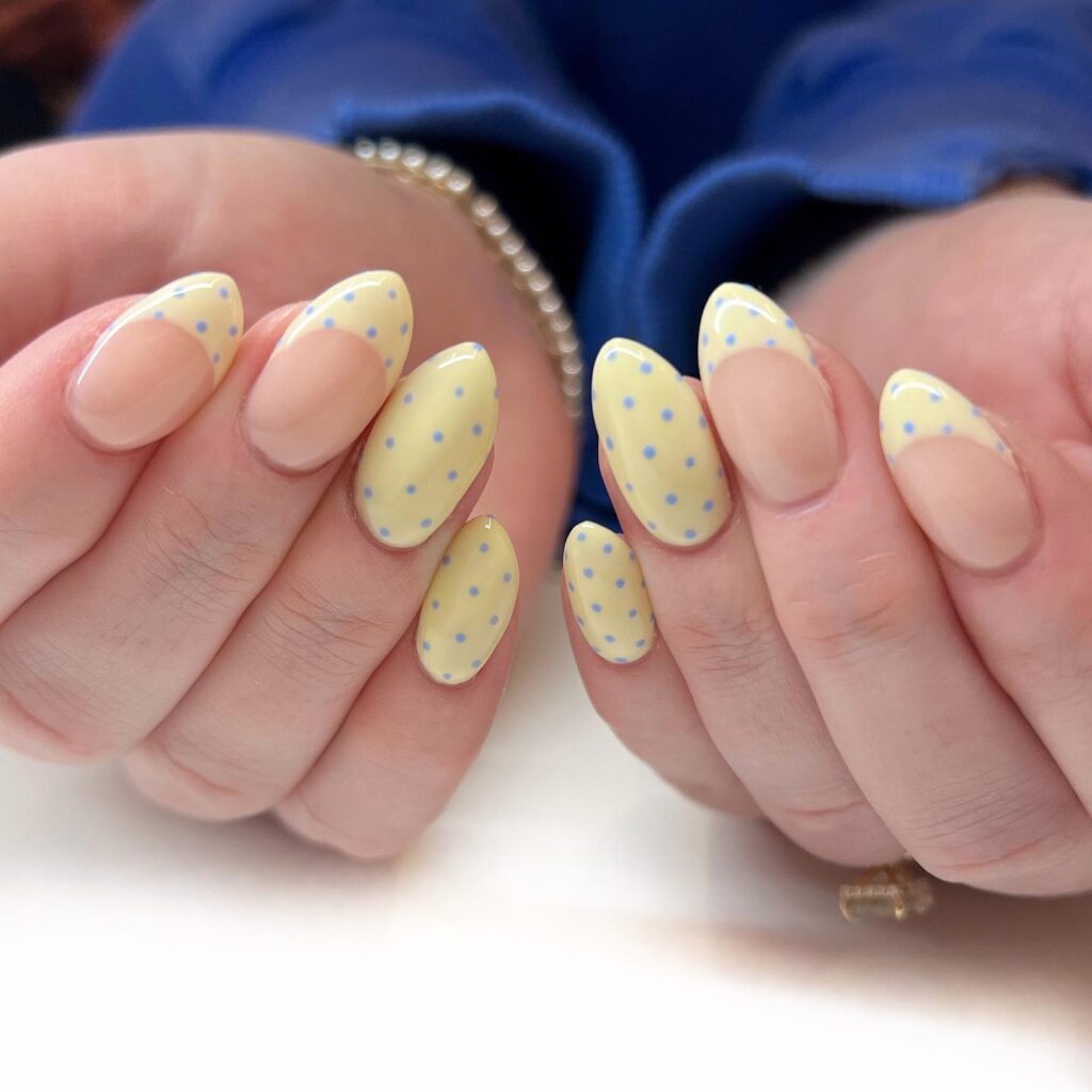 Pastel Yellow Polka Dot Nails With Negative Space Design for a Playful Summer Look
