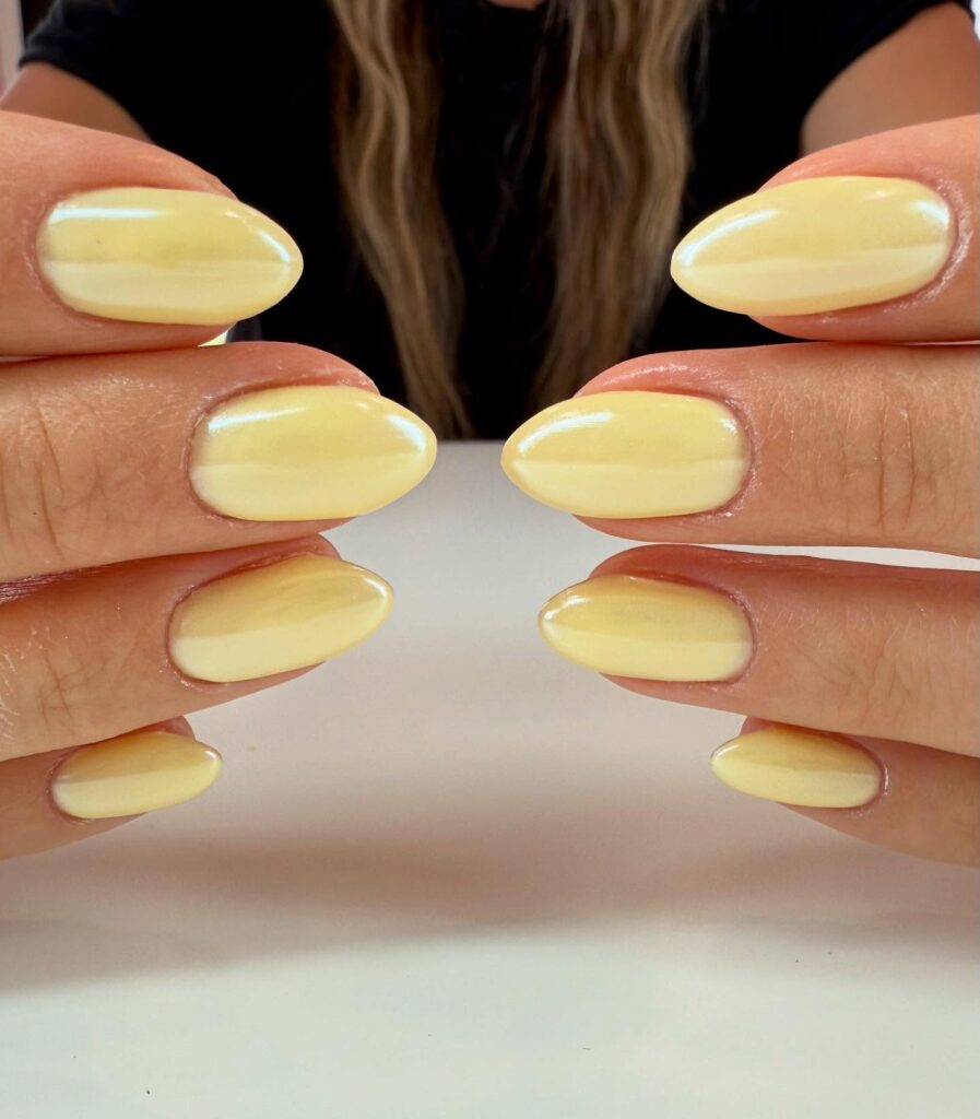 Pearlescent Almond Yellow Nails for a Simple Yet Polished Look