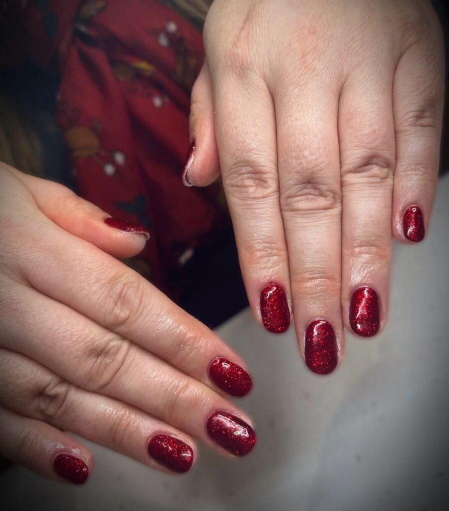 Red Glitter Rounded Nails for a Festive and Classic Holiday Manicure