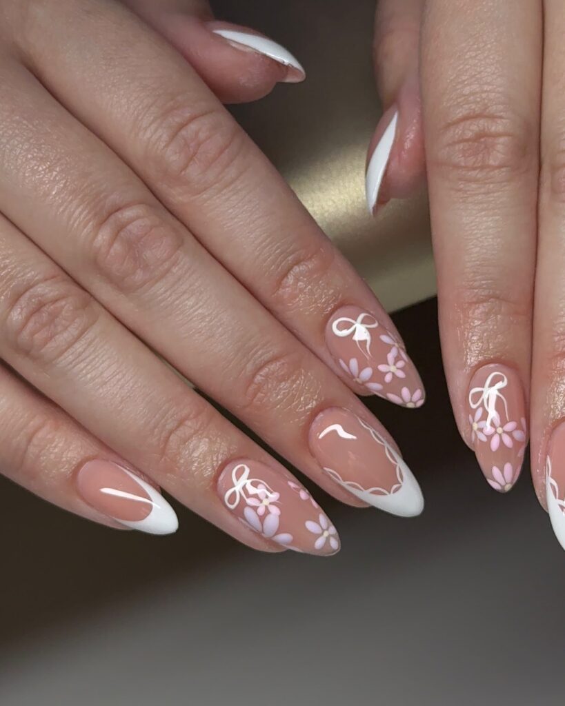 Romantic French Tip Almond Nails with Ribbons and Spring Floral Accents